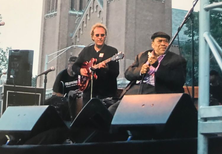 A picture of Harry Hmura with James Cotton.